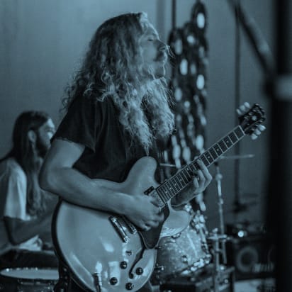 Person playing guitar at The Roadies Brewing Co. in Vista CA