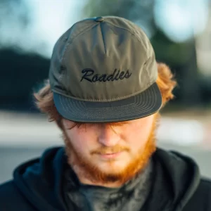 Person wearing olive cap