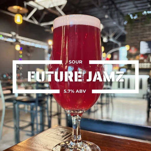 Glass of Future Jamz fruited sour on a counter at the roadies brewing co. in vista CA