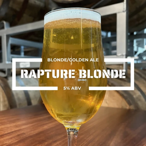 Glass of Rapture Blonde on a counter at the roadies brewing co. in vista CA
