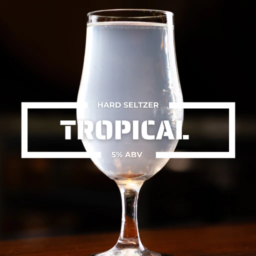 Glass of Tropical hard seltzer on a counter at the roadies brewing co. in vista CA